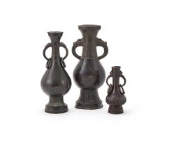 Two Chinese bronze dragon-mask two-handled vases