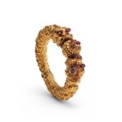 A gold bangle composed of kirtimukha faces