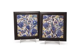 A pair of Qajar glazed polychrome tiles