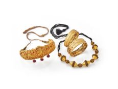 A gem-set gold coloured ruby and emerald necklace