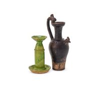 A Chinese green-glazed candle holder