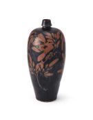 A large Chinese russet-splashed black glazed bottle vase