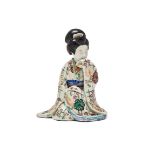A Japanese Arita Erotic porcelain model of a kneeling Bijin
