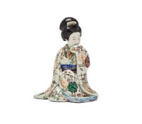 A Japanese Arita Erotic porcelain model of a kneeling Bijin