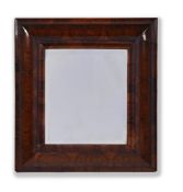 A WILLIAM AND MARY WALNUT OYSTER VENEERED CUSHION FRAMED WALL MIRROR, CIRCA 1695