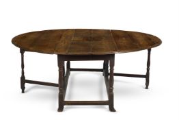 A QUEEN ANNE OAK GATE-LEG DINING TABLE, EARLY 18TH CENTURY