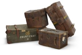 A GROUP OF FOUR LEATHER AND CANVAS TRAVELLING CASES