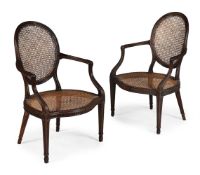 A PAIR OF GEORGE III MAHOGANY ARMCHAIRS, AFTER DESIGNS BY JOHN LINNELL, CIRCA 1770