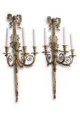 A LARGE PAIR OF ORMOLU THREE BRANCH WALL LIGHTS, IN THE LOUIS XVI STYLE, EARLY 20TH CENTURY