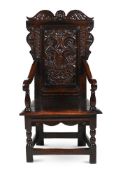 A CHARLES I OAK WAINSCOT ARMCHAIR, YORKSHIRE, CIRCA 1640