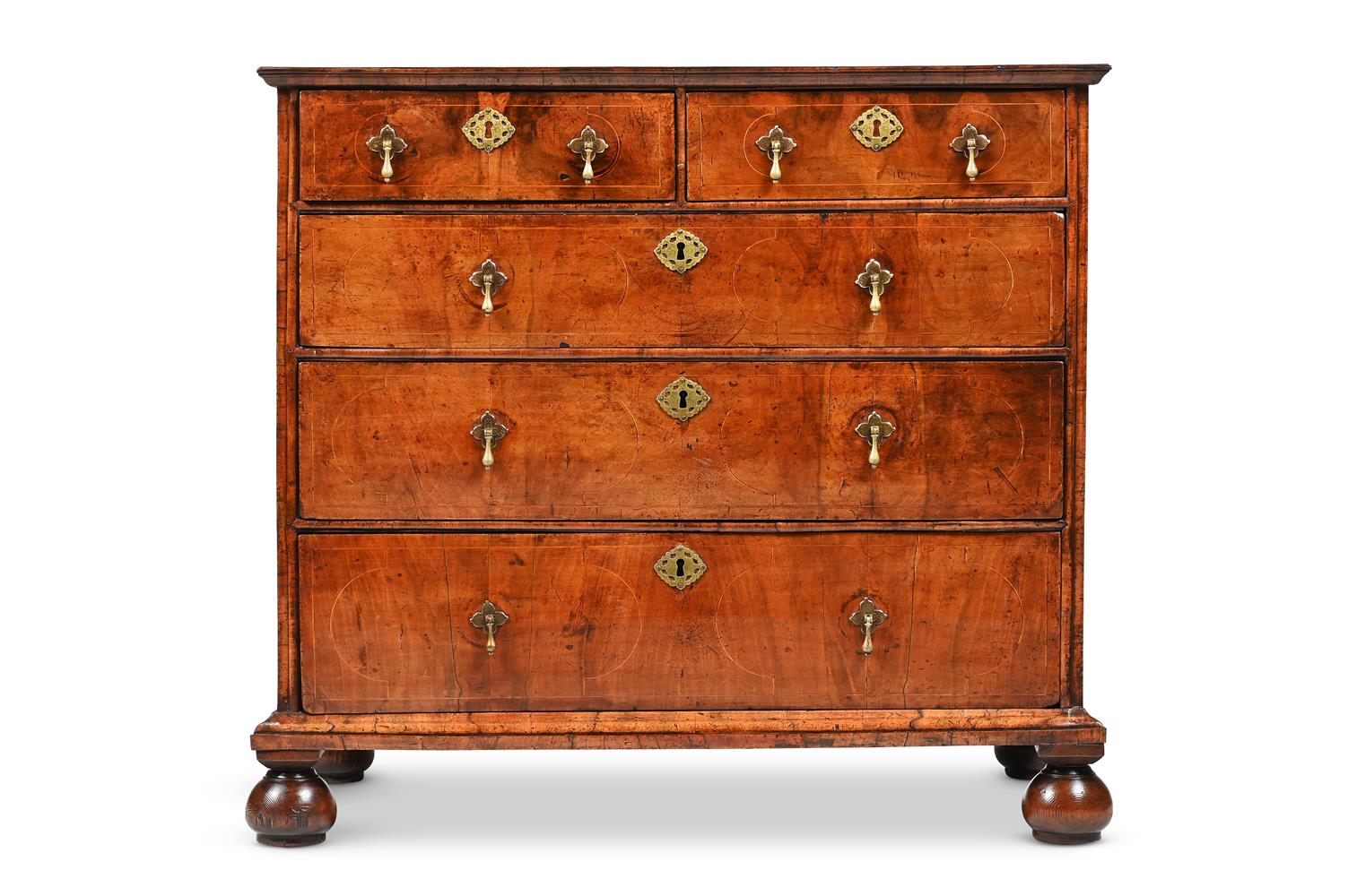 A QUEEN ANNE FIGURED WALNUT CHEST OF DRAWERS, CIRCA 1710