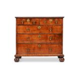 A QUEEN ANNE FIGURED WALNUT CHEST OF DRAWERS, CIRCA 1710