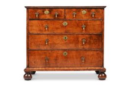 A QUEEN ANNE FIGURED WALNUT CHEST OF DRAWERS, CIRCA 1710