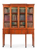Y A GEORGE III SATINWOOD AND TULIPWOOD CROSSBANDED BREAKFRONT SECRETAIRE CABINET, CIRCA 1790
