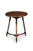 A GEORGE III OAK AND ELM CRICKET TABLE, LATE 18TH CENTURY