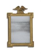 A GEORGE II CARVED GILTWOOD MIRROR, IN THE MANNER OF WILLIAM KENT, CIRCA 1740