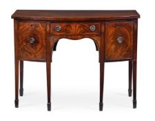 Y A GEORGE III MAHOGANY AND TULIPWOOD CROSSBANDED BOWFRONT SIDEBOARDCIRCA 1780The front with stylize