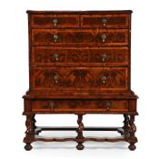 A WILLIAM & MARY OLIVEWOOD 'OYSTER' VENEERED CHEST ON STAND, CIRCA 1690