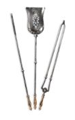 A GEORGE III SET OF THREE BRASS HANDLED POLISHED STEEL FIRE TOOLS, CIRCA 1800