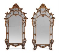 A LARGE PAIR OF EARLY LOUIS XV CARVED GILTWOOD AND GESSO MIRRORS, CIRCA 1730
