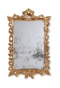 A GEORGE III CARVED GILTWOOD MIRROR, CIRCA 1780