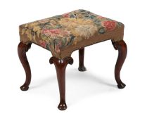 A GEORGE I WALNUT AND NEEDLEWORK STOOL, CIRCA 1720