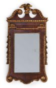 A GEORGE II WALNUT AND PARCEL GILT MIRROR, CIRCA 1740