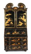 A CHINESE EXPORT BLACK AND GILT LACQUER BUREAU CABINET, MID 18TH CENTURY