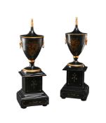 A PAIR OF BLACK AND GILT CHESTNUT URNS, ITALIAN, IN REGENCY STYLE, OF RECENT MANUFACTURE
