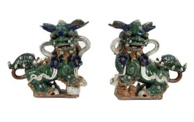 A LARGE PAIR OF CHINESE POLYCHROME 'TEMPLE DOGS', LATE 19TH OR EARLY 20TH CENTURY