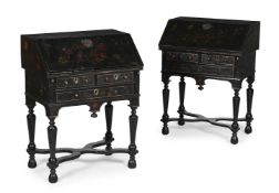 A PAIR OF BLACK LACQUER AND POLYCHROME DECORATED BUREAUS, IN LATE 17TH CENTURY STYLE