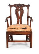 A GEORGE III CARVED WALNUT OPEN ARMCHAIR, POSSIBLY IRISH, THIRD QUARTER 18TH CENTURY