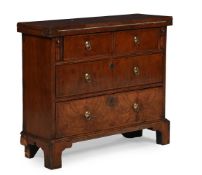 A WALNUT AND FEATHERBANDED BACHELOR'S CHEST, IN GEORGE I STYLE, INCORPORATING 18TH CENTURY ELEMENTS