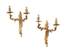 A PAIR OF GILT METAL TWIN BRANCH WALL LIGHTS IN LOUIS XV STYLE, FIRST HALF 20TH CENTURY