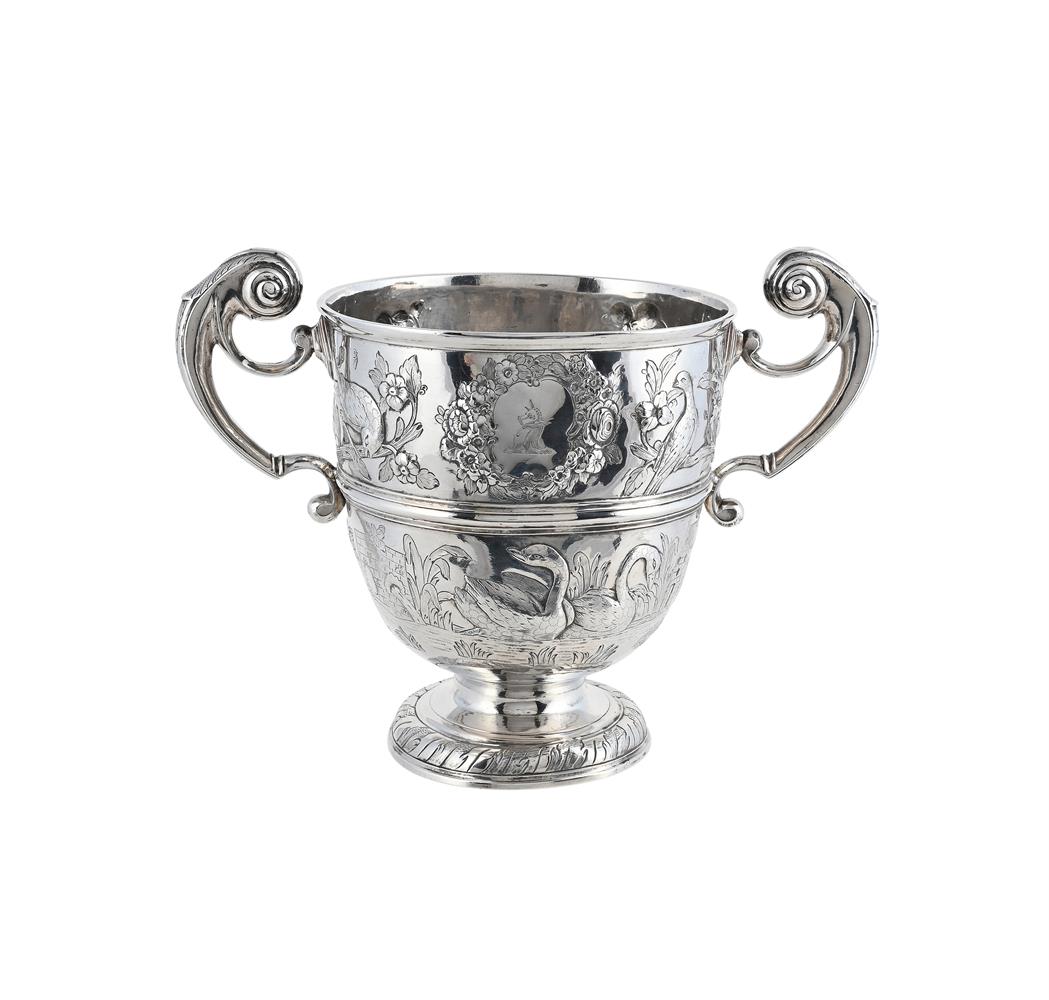 A GEORGE II IRISH SILVER TWIN HANDLED CUP