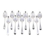 ELEVEN GEORGIAN SILVER OLD ENGLISH PATTERN TABLE SPOONS