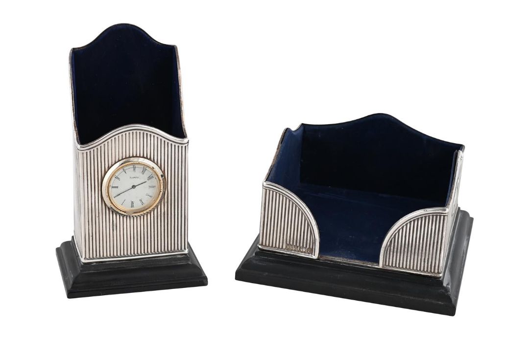 A SILVER MOUNTED DESK CLOCK/PEN HOLDER AND NOTEPAD HOLDER