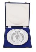 A CASED SILVER COMMEMORATIVE PLATE