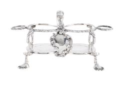 A GEORGE III SILVER TWO BOTTLE CRUET STAND