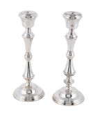 A PAIR OF SILVER CANDLESTICKS