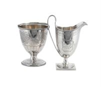 A GEORGE III SILVER HELMET SHAPED CREAM JUG