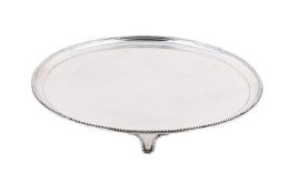 A GEORGE III SILVER CIRCULAR SALVER