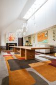 AN OAK DINING TABLE OF VERY LONG PROPORTION, DESIGNED BY PETER MIKIC, MODERN