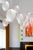 NINETEEN CRACKLE GLASS PENDANT LAMPS, MODERN