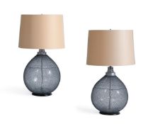 A PAIR OF MESH CLAD CARBOYS FITTED AS LAMPS, MID 20TH CENTURY AND LATER