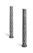 A PAIR OF BLACK AND WHITE PAINTED WOOD COLUMNS, ITALIAN, 18TH OR 19TH CENTURY