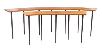 A PAIR OF WALNUT AND IRON CURVED CONSOLE TABLES, DESIGNED BY PETER MIKIC, MODERN