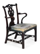 A GEORGE III MAHOGANY AND LEATHER UPHOLSTERED OPEN ARMCHAIR, CIRCA 1800