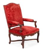 A RED UPHOLSTERED ARMCHAIR, FRENCH, 19TH CENTURY