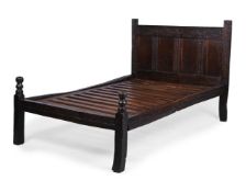 AN OAK BED INCORPORATING ASSOCIATED 17TH CENTURY AND LATER ELEMENTS